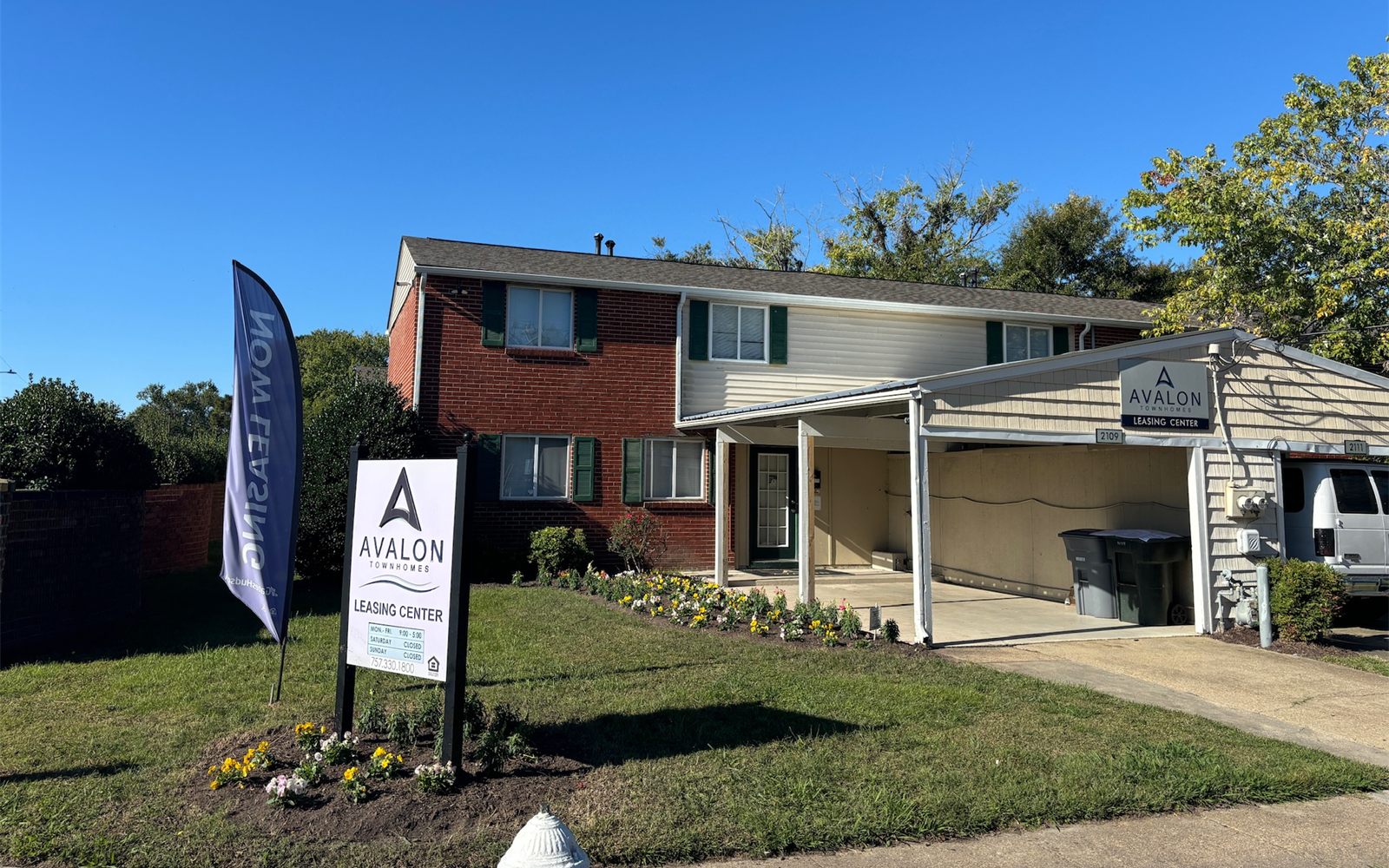 The Avalon Townhomes leasing center and sign
