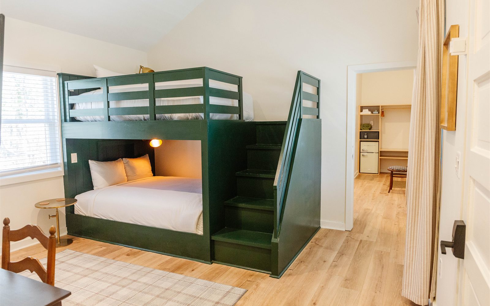 A Rochambeau family suite with a built-in green bunk bed